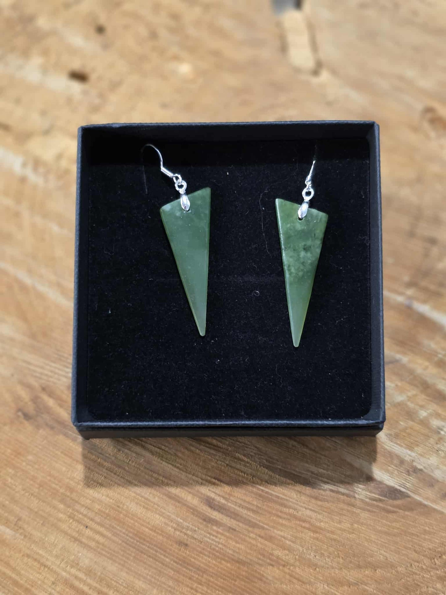 Pounamu triangle shaped earrings on silver hooks