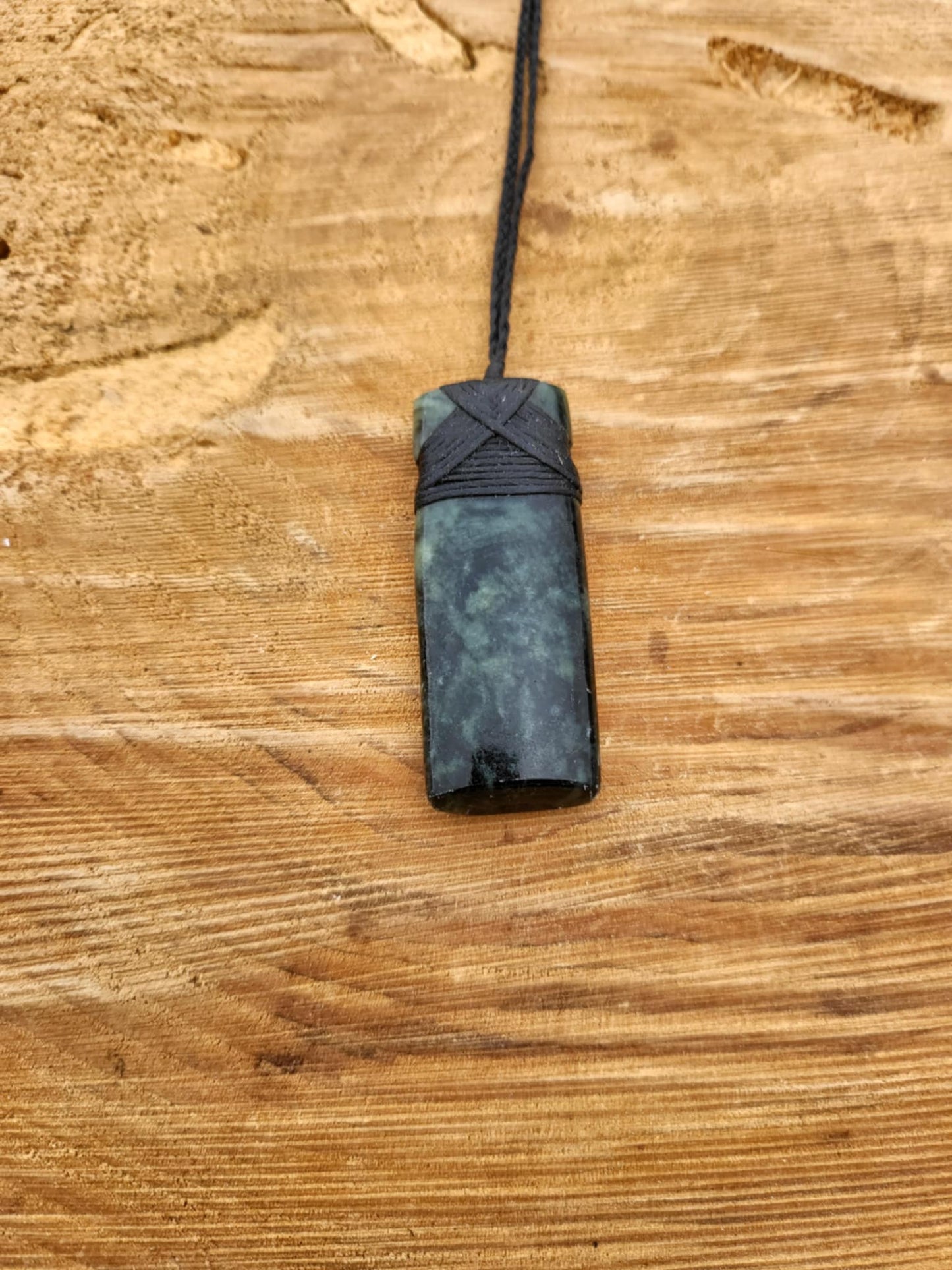 Pounamu toki (adze) necklace with beautiful colour variations