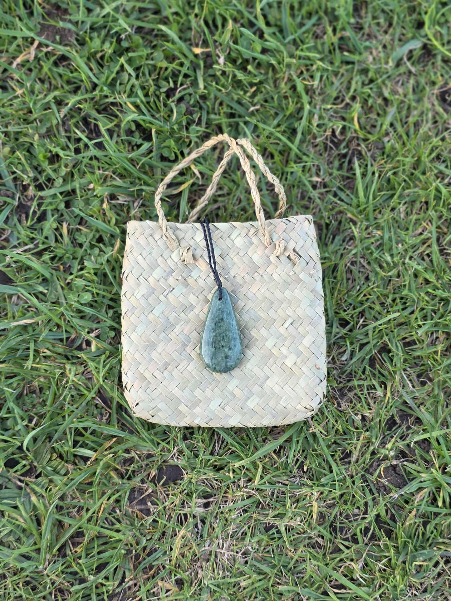 Pounamu (greenstone) roimata (tear drop) necklace on black braiding