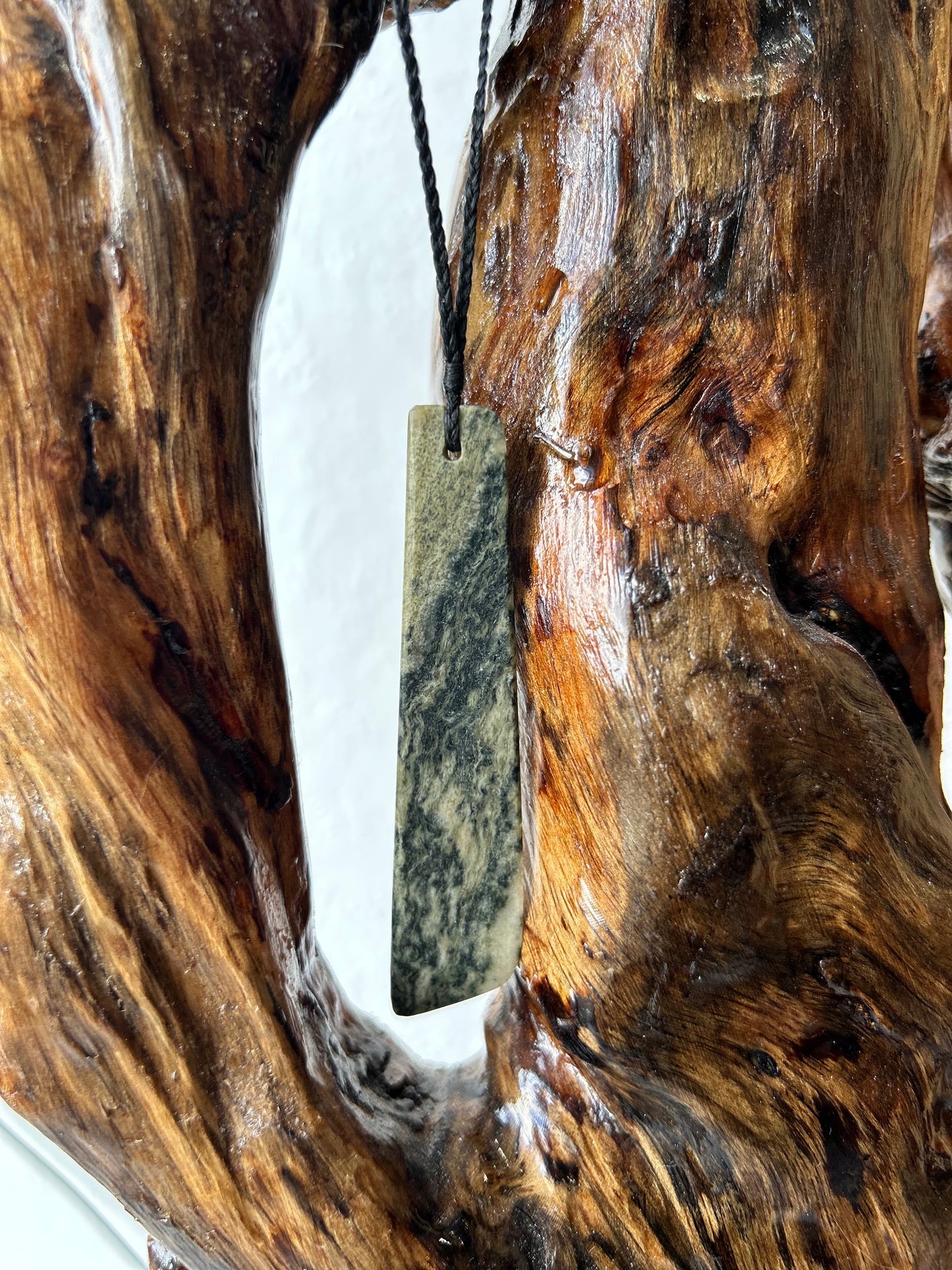 carved pounamu toki (adze) necklace on black cord, beautiful colour variation