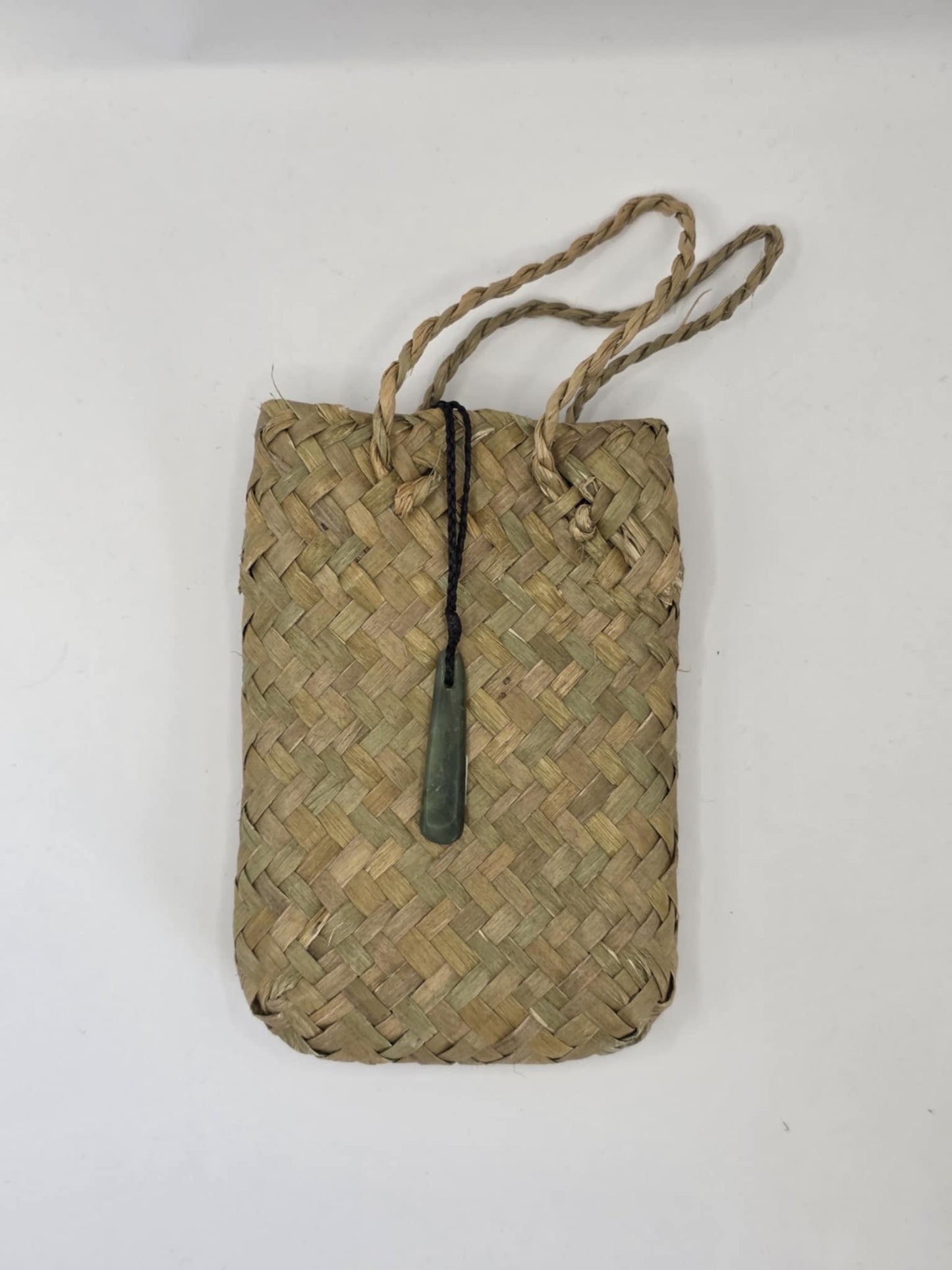 small carved pounamu roimata (tear drop) necklace, on black cord