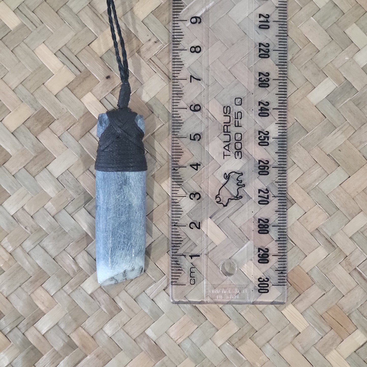 carved pounamu toki (adze) necklace, on black cord