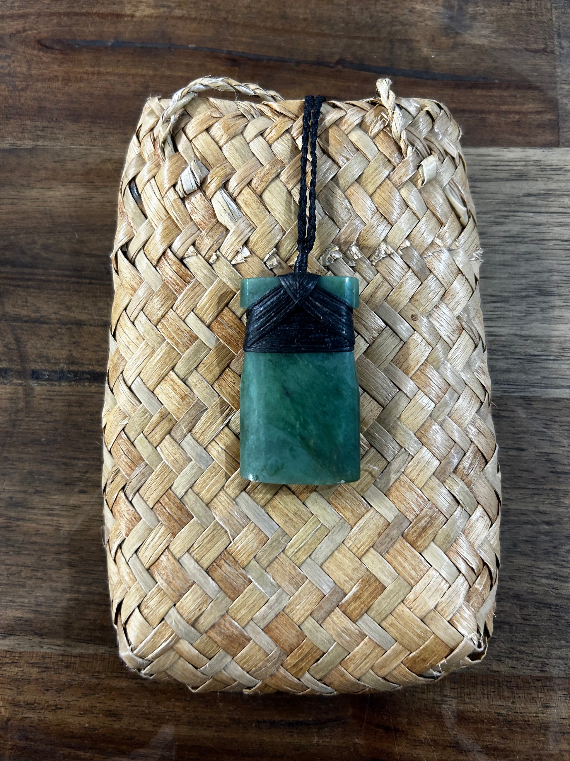 Pounamu greenstone toki (adze) necklace with black strapping