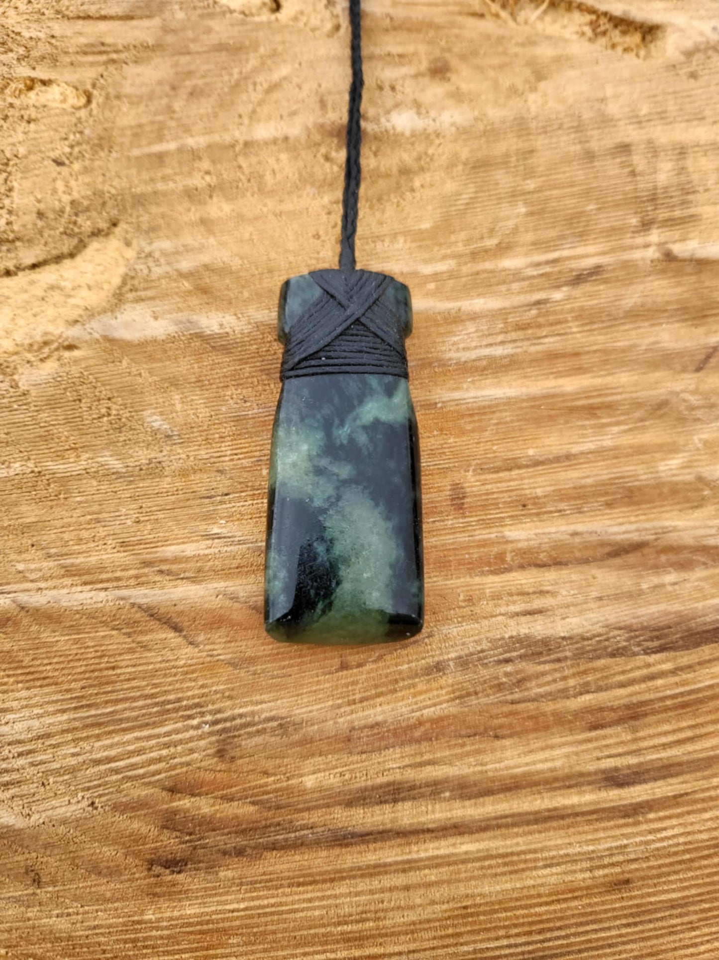 Pounamu toki (adze) necklace with beautiful colour variations
