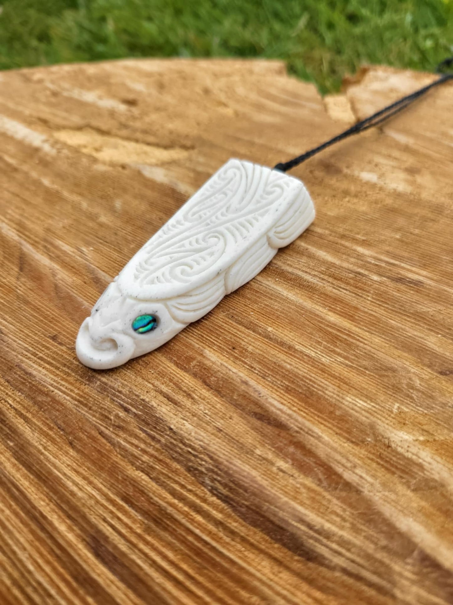 whalebone and paua shell carved eel necklace (taonga)