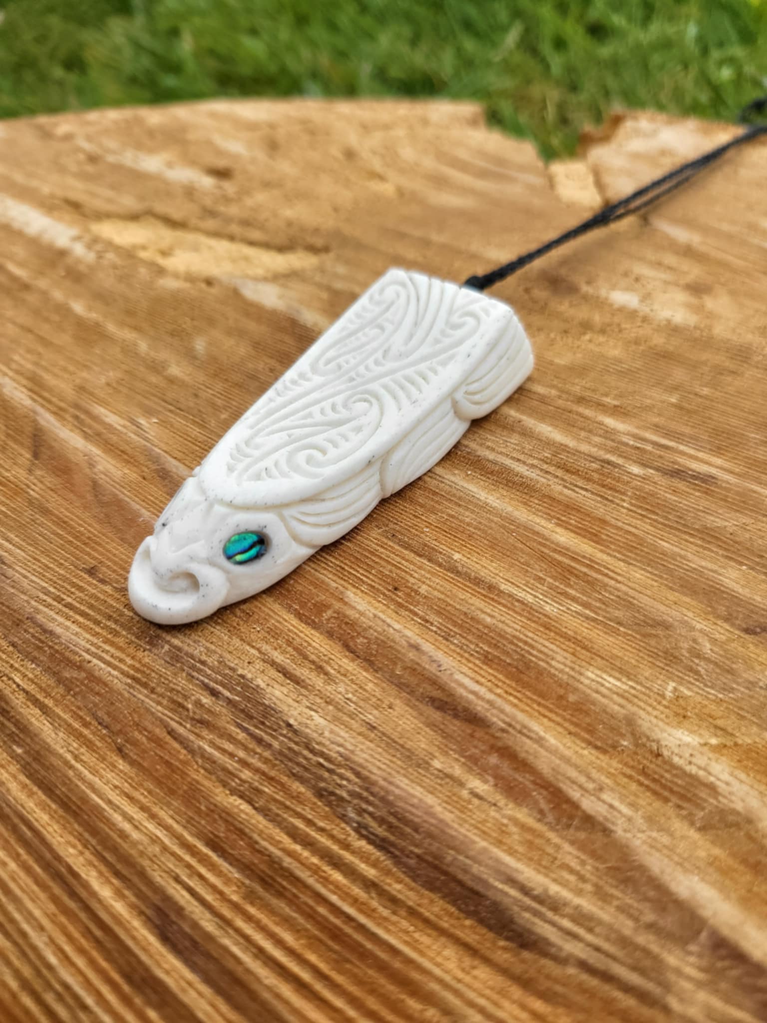 whalebone and paua shell carved eel necklace (taonga)
