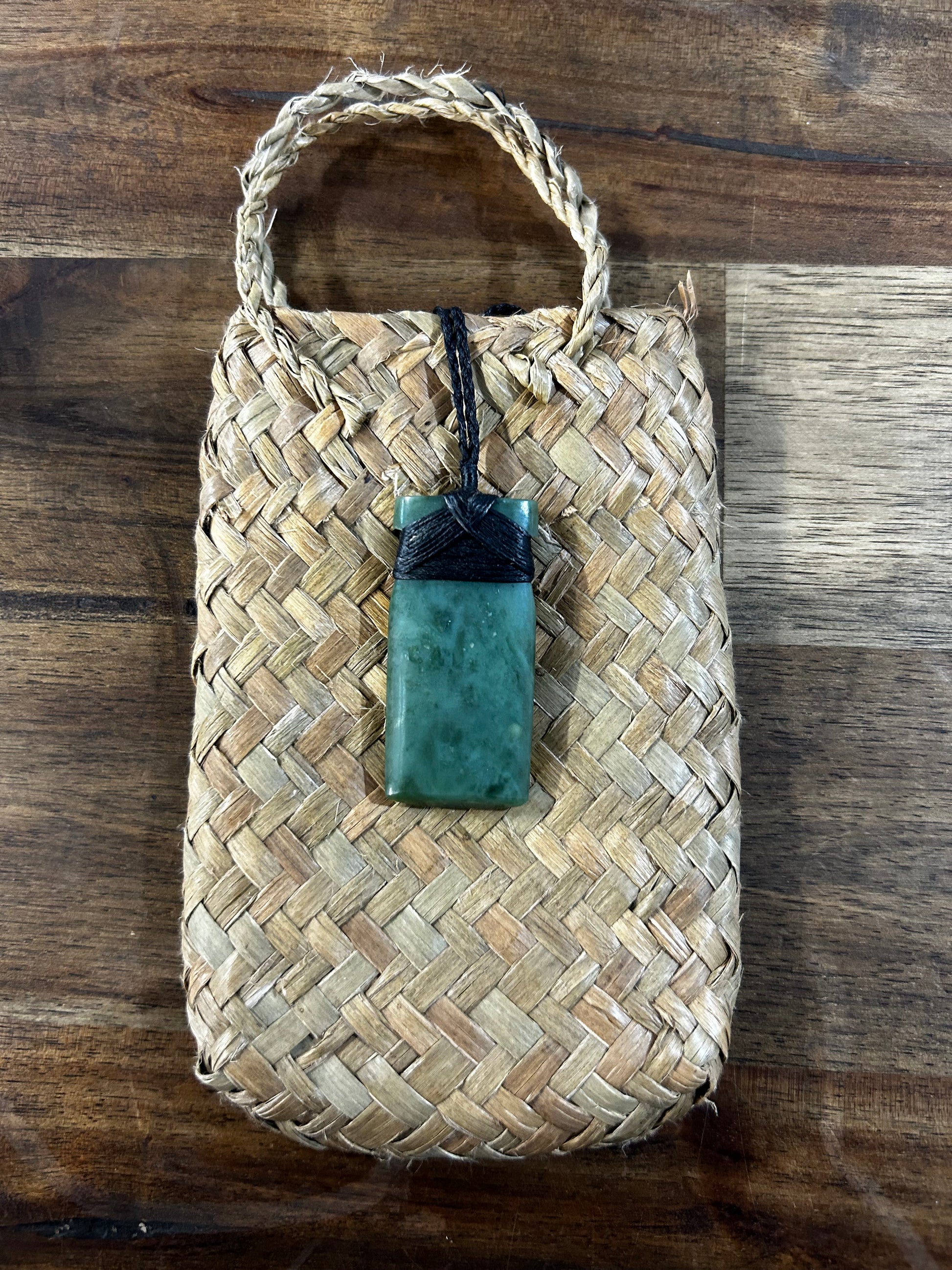 Pounamu greenstone toki (adze) necklace with black strapping