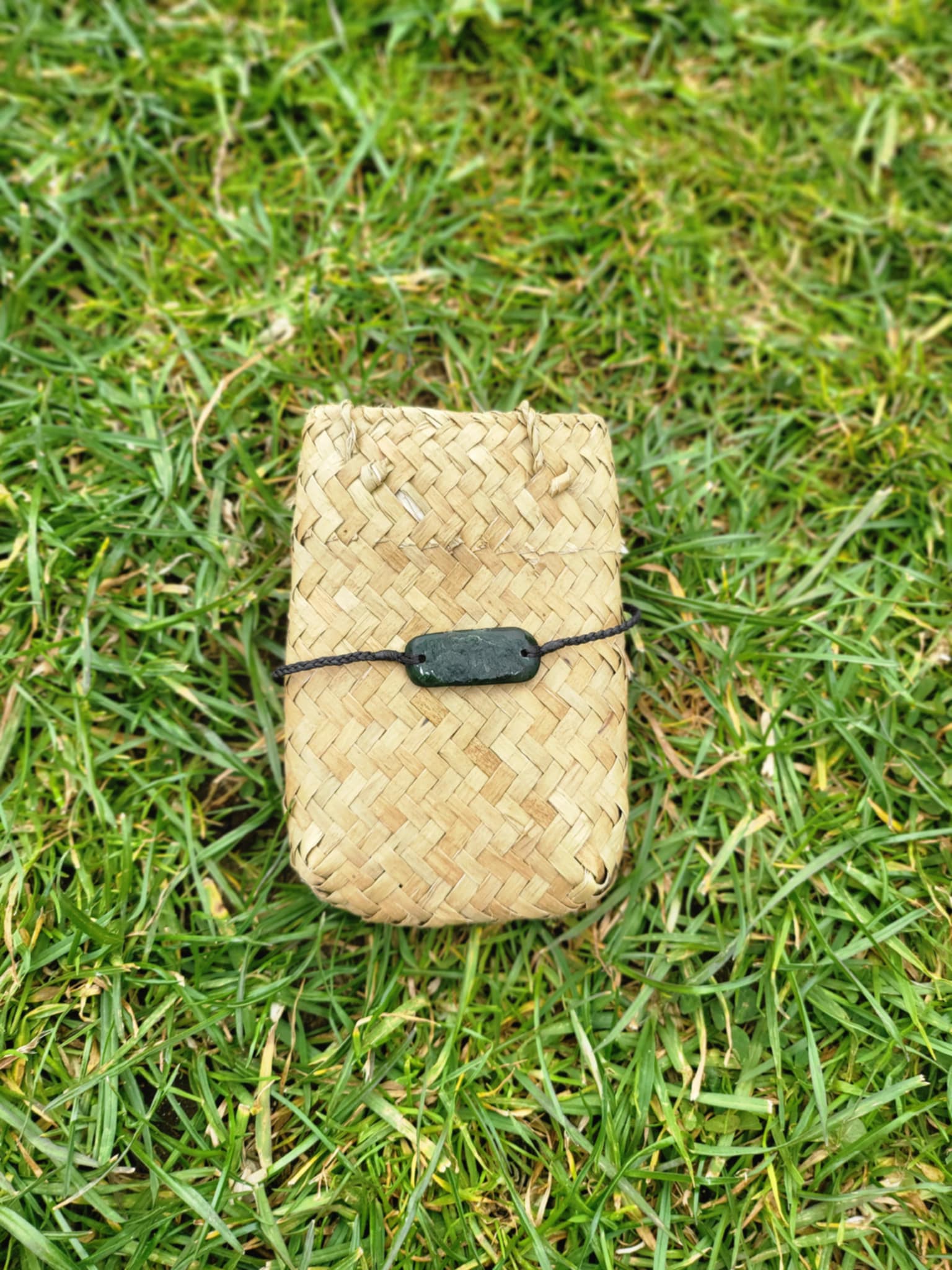 pounamu bracelet (rounded rectangle) on black cord