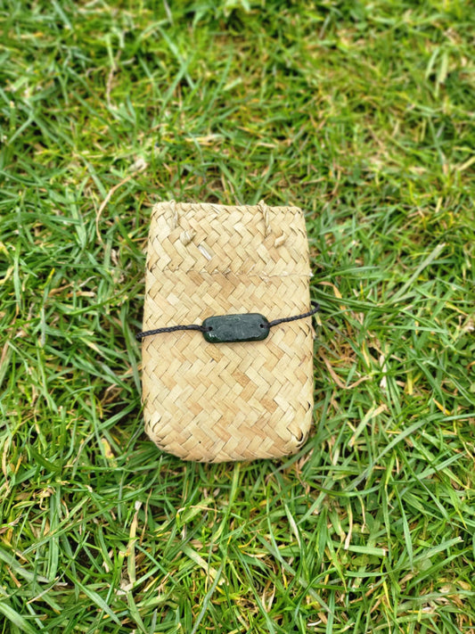 pounamu bracelet (rounded rectangle) on black cord