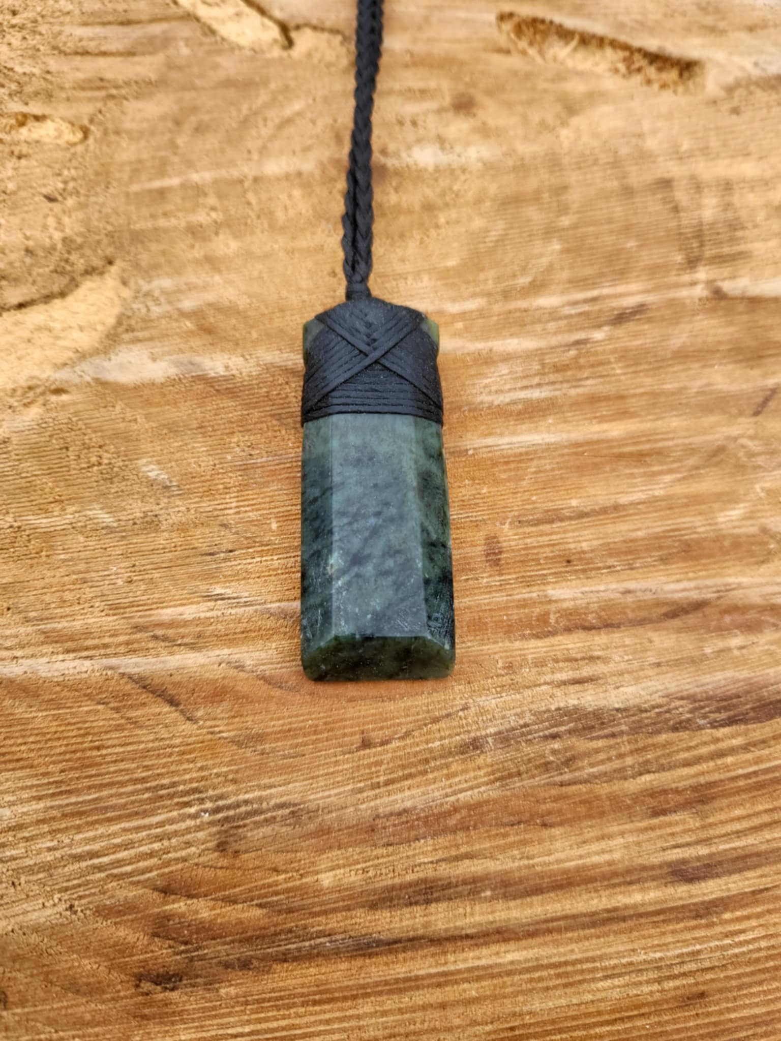 Pounamu toki (adze) necklace with beautiful colour variations