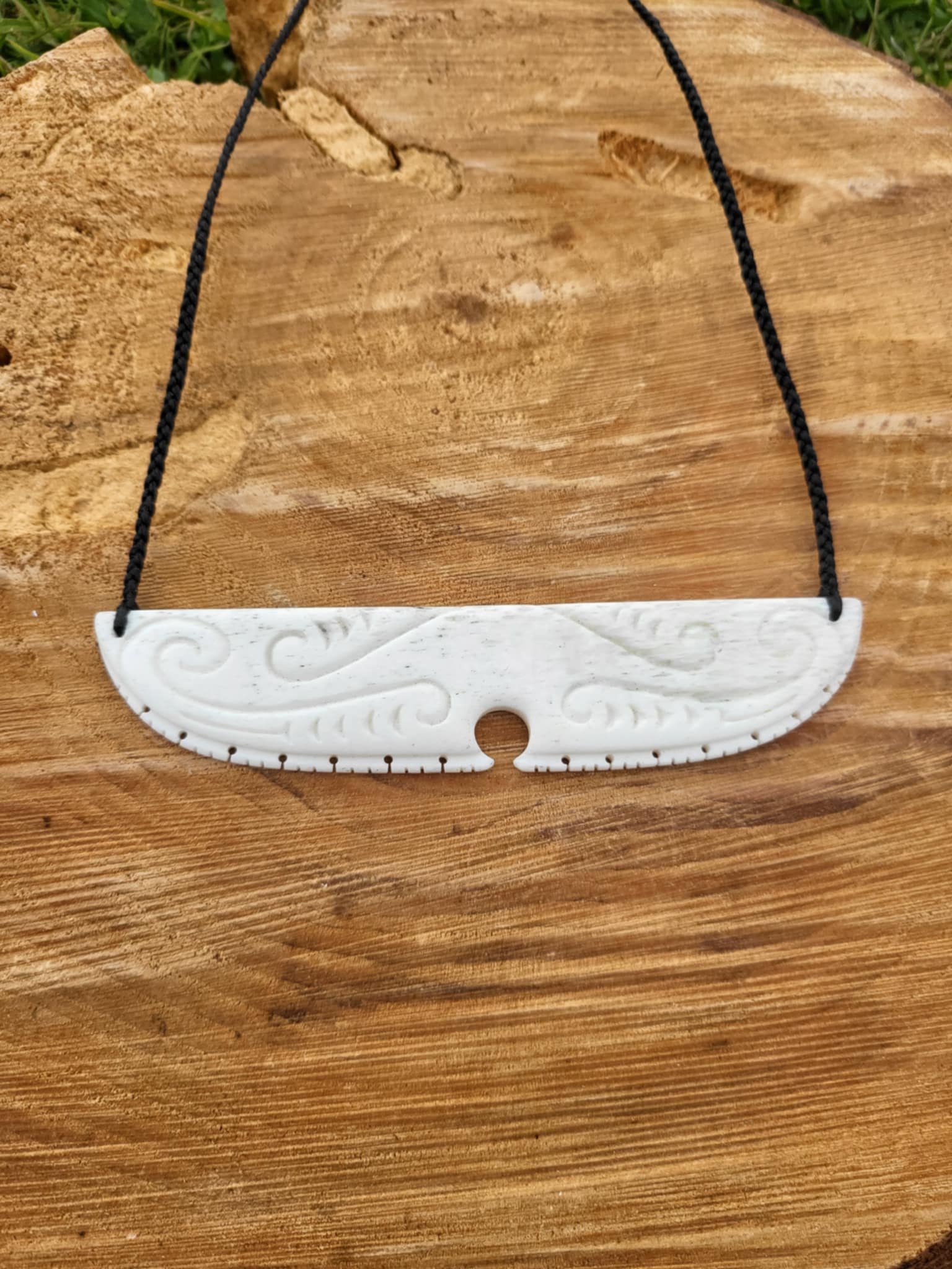 whalebone carved chest plate necklace on black cord