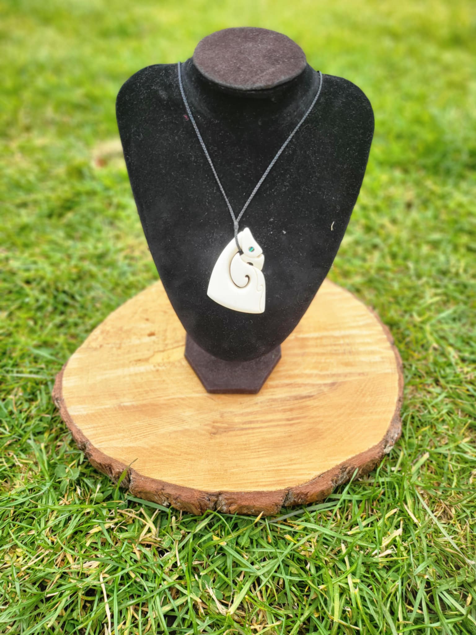 carved bone matau manaia necklace (triangular shape) on black cord
