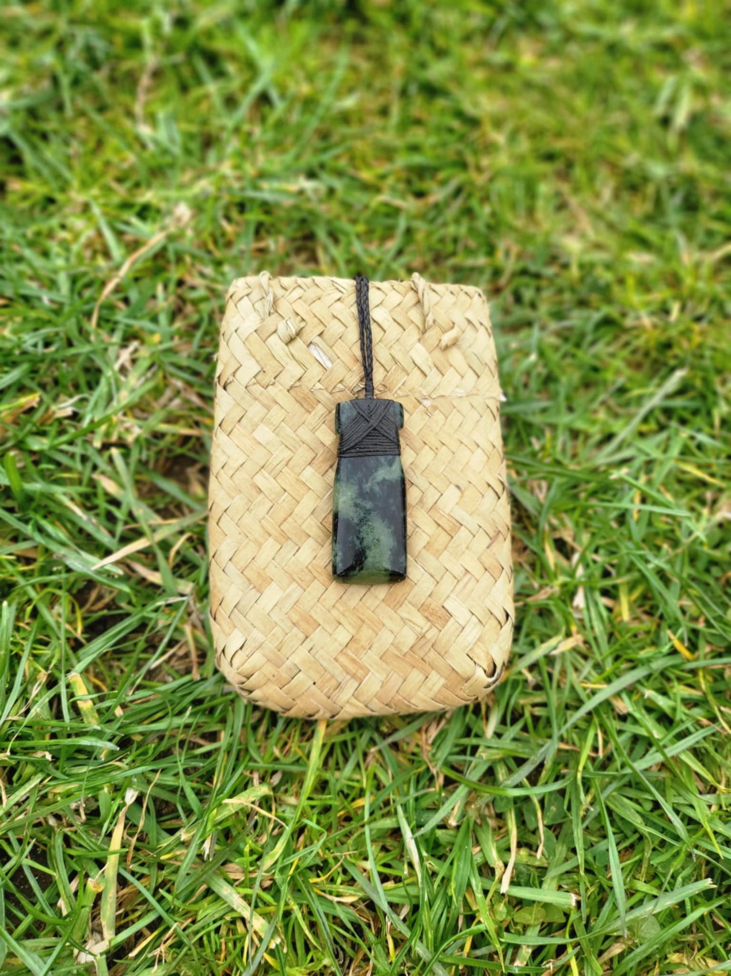 Pounamu toki (adze) necklace with beautiful colour variations