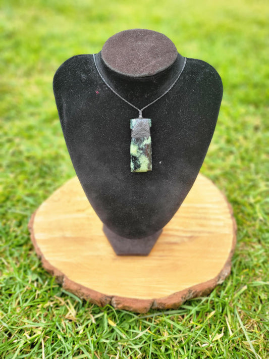 Pounamu toki (adze) necklace with beautiful colour variations