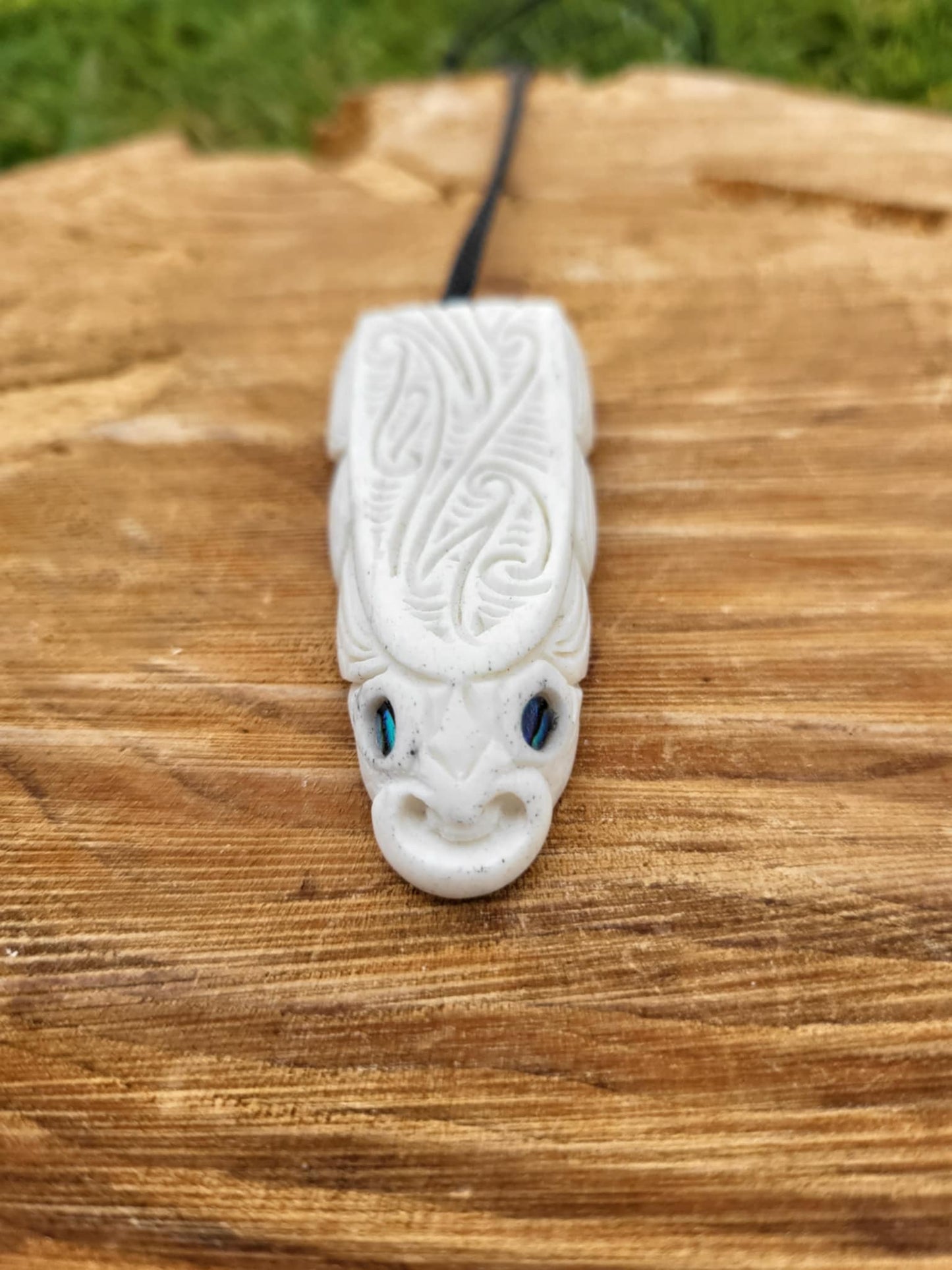 whalebone and paua shell carved eel necklace (taonga)
