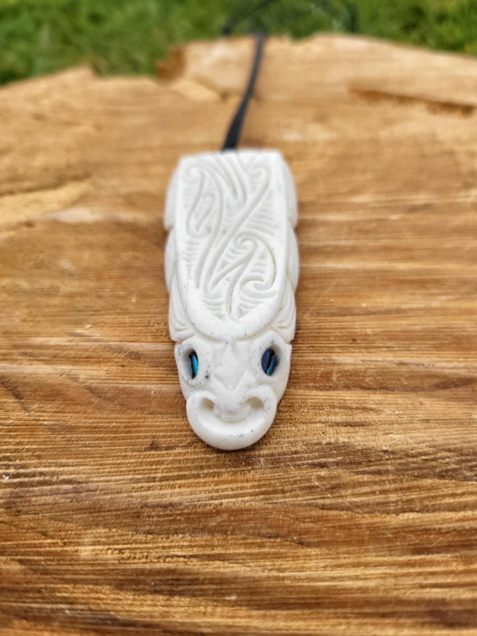 whalebone and paua shell carved eel necklace (taonga)