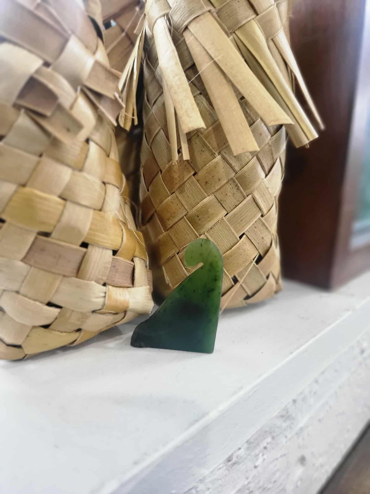 Freestanding ngaru (wave) carved from pounamu (greenstone)