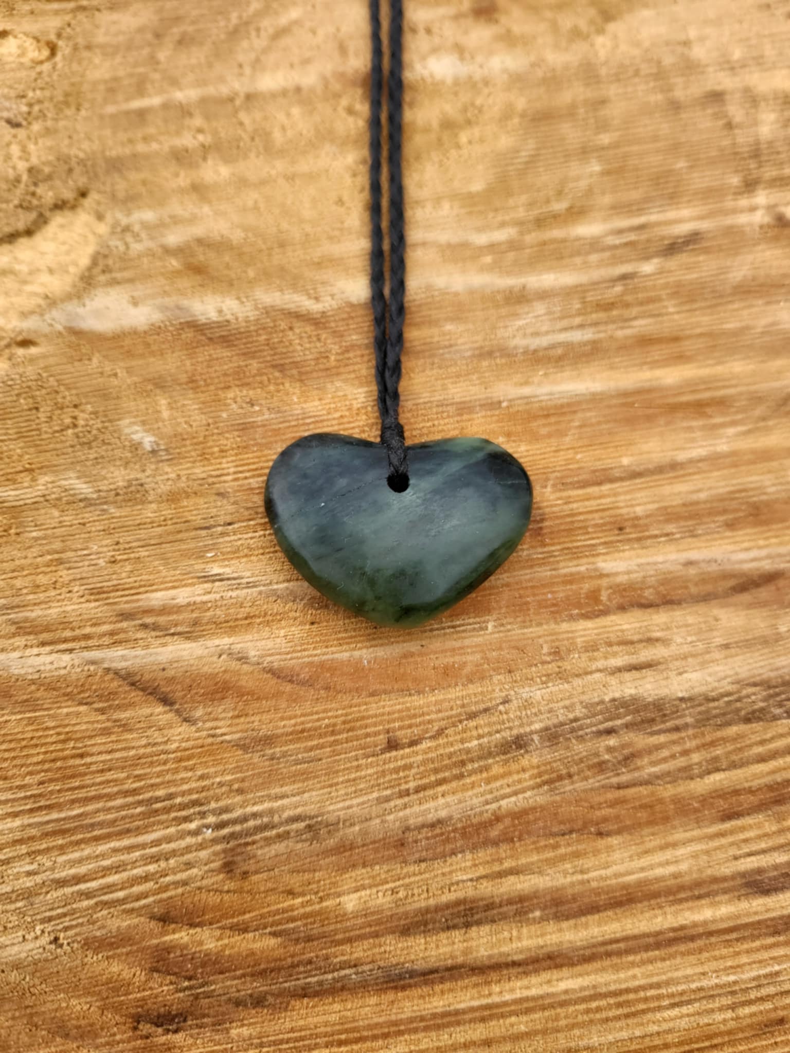 Heart shaped pounamu necklace on black cord (small)
