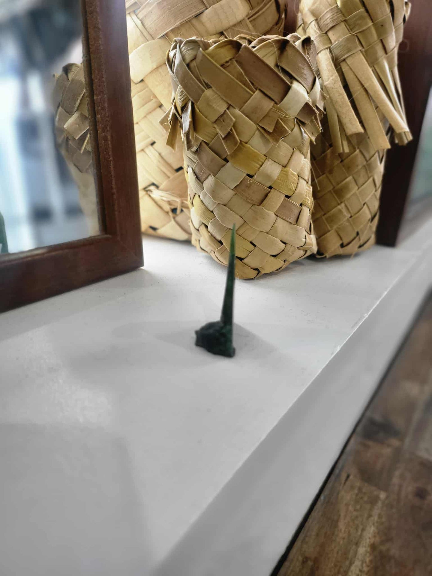 Freestanding ngaru (wave) carved from pounamu (greenstone)