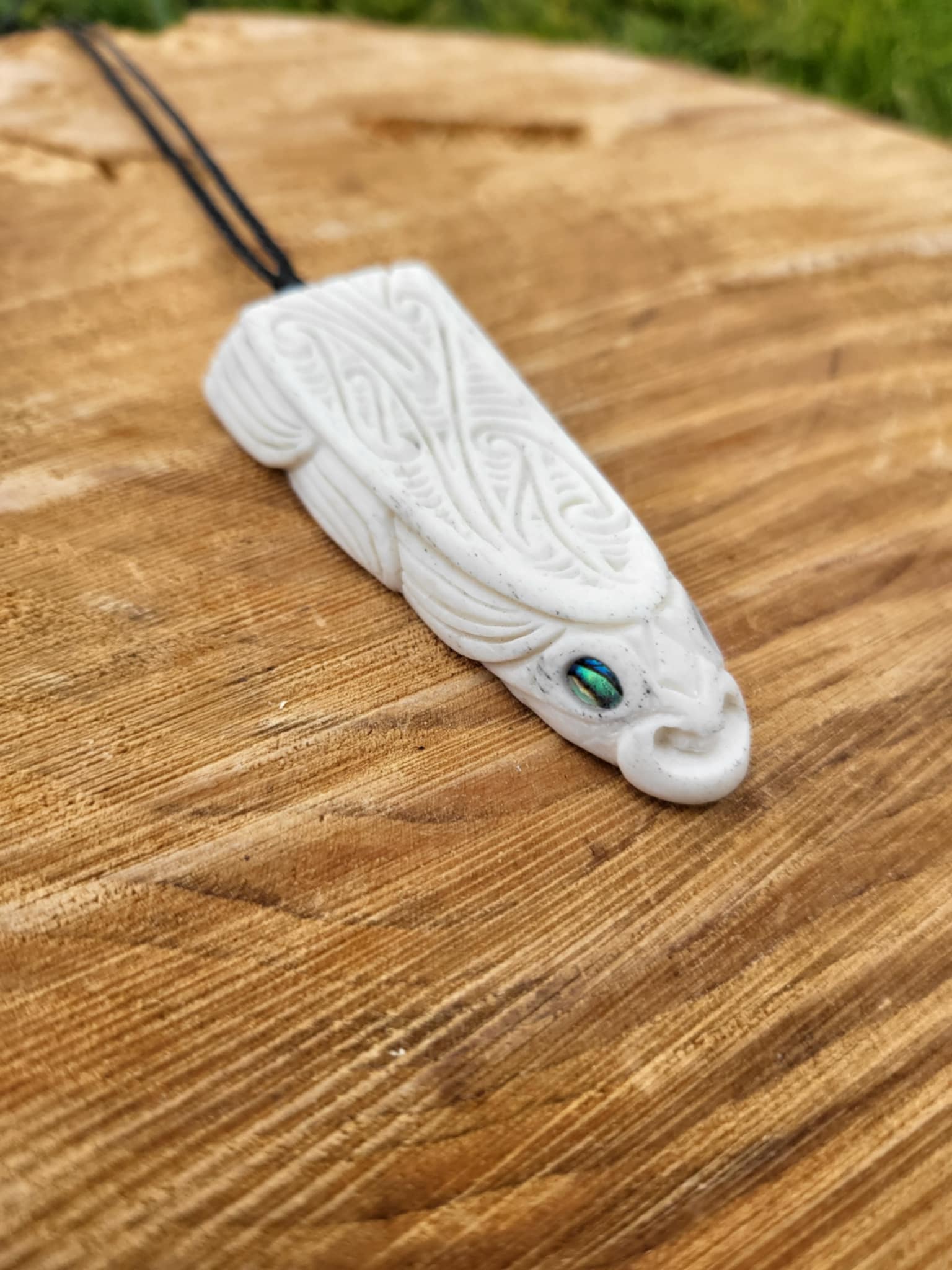 whalebone and paua shell carved eel necklace (taonga)
