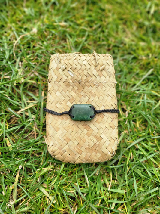 pounamu bracelet (rounded rectangle) on black cord