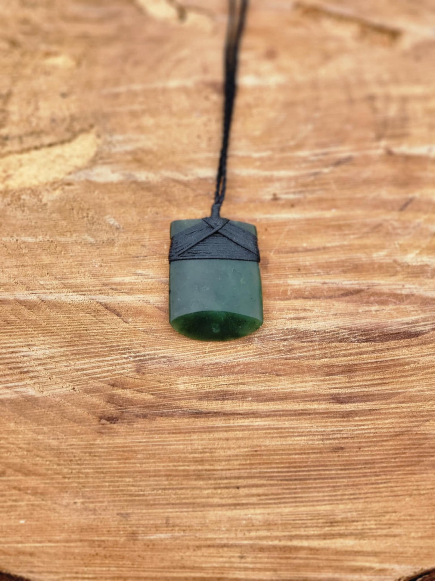 carved pounamu toki (adze) small on black cord