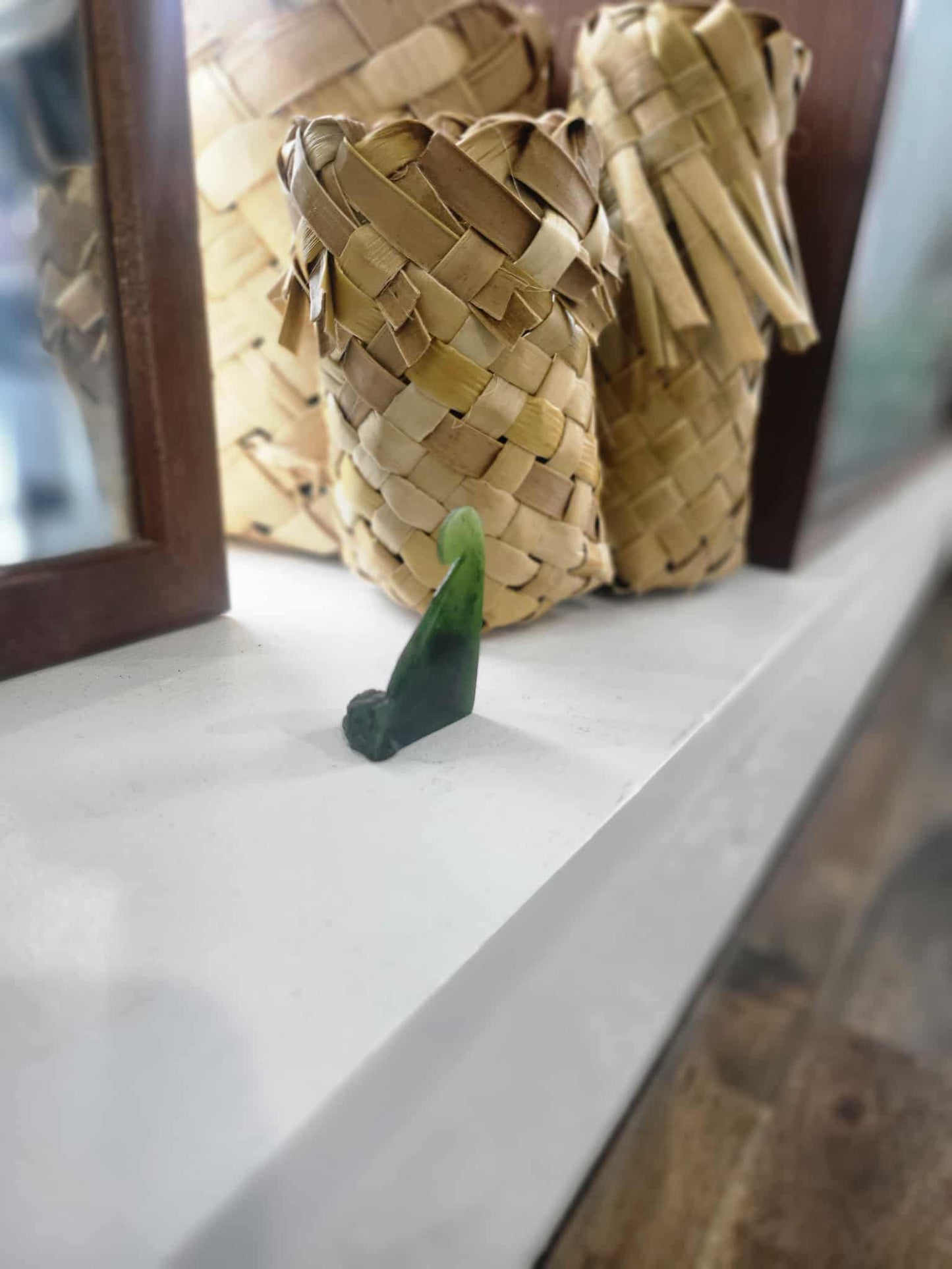 Freestanding ngaru (wave) carved from pounamu (greenstone)