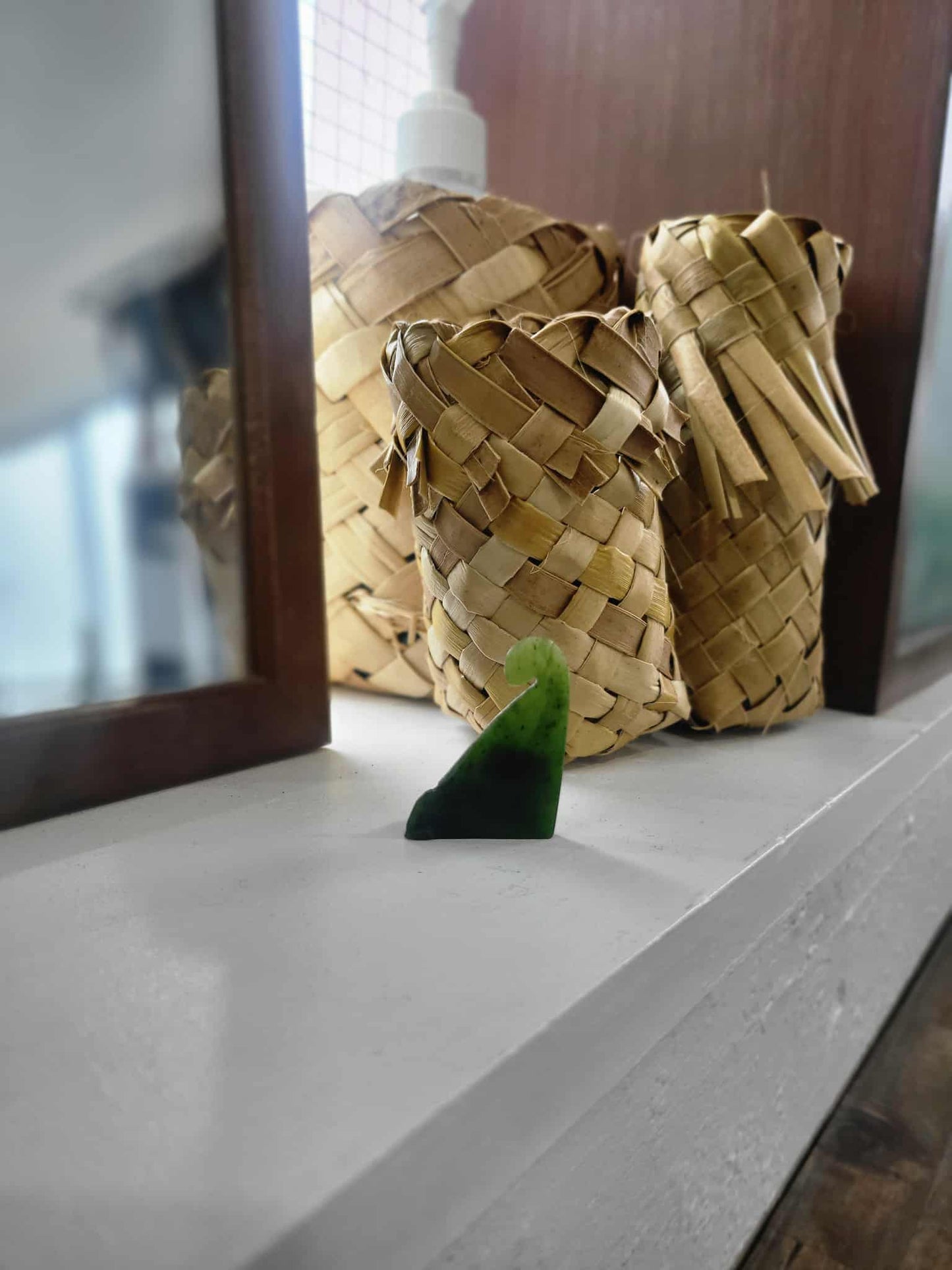 Freestanding ngaru (wave) carved from pounamu (greenstone)