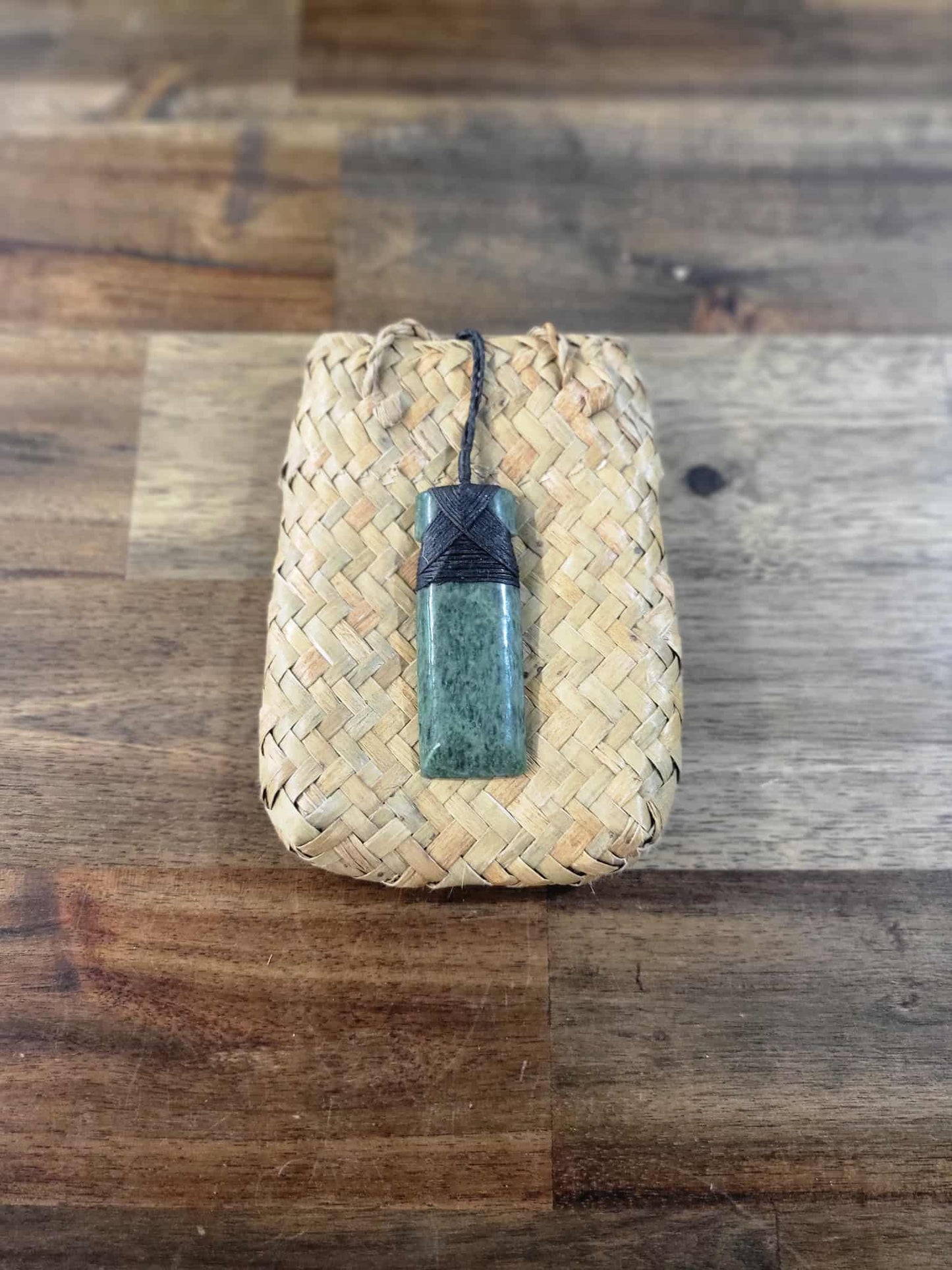 Pounamu greenstone toki (adze) necklace with black strapping