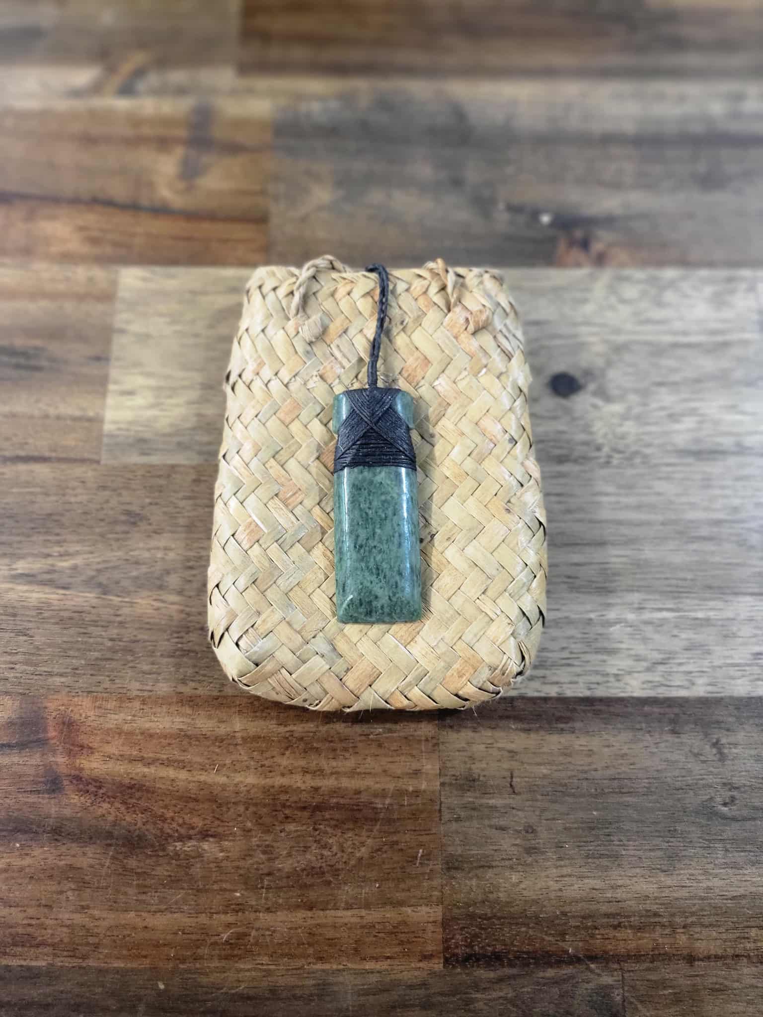 Pounamu greenstone toki (adze) necklace with black strapping