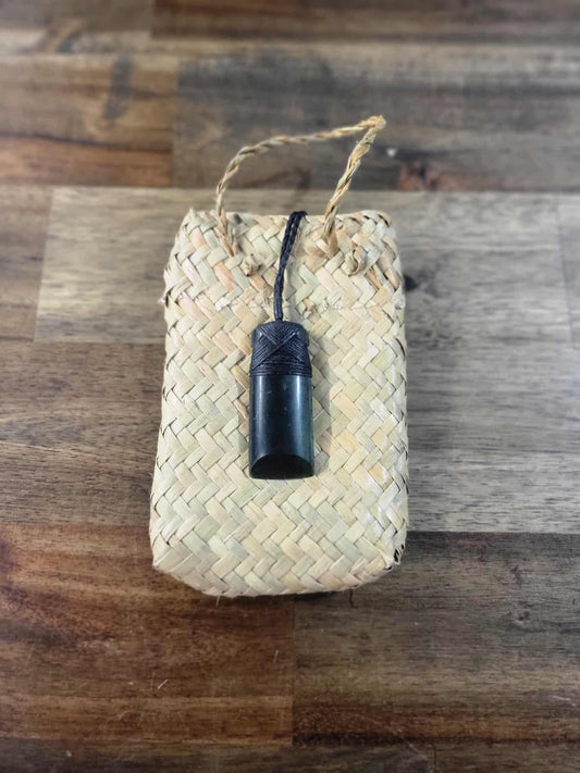 Dark green pounamu greenstone toki (adze) necklace with black strapping