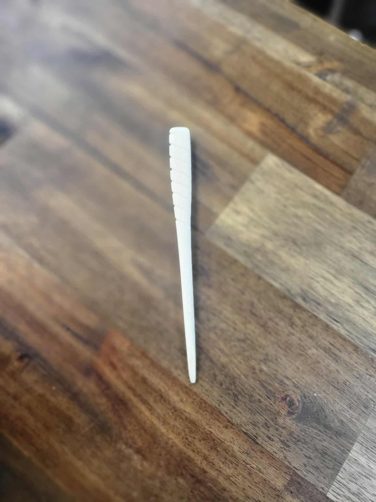 Small bone carved tewhatewha (weapon) 