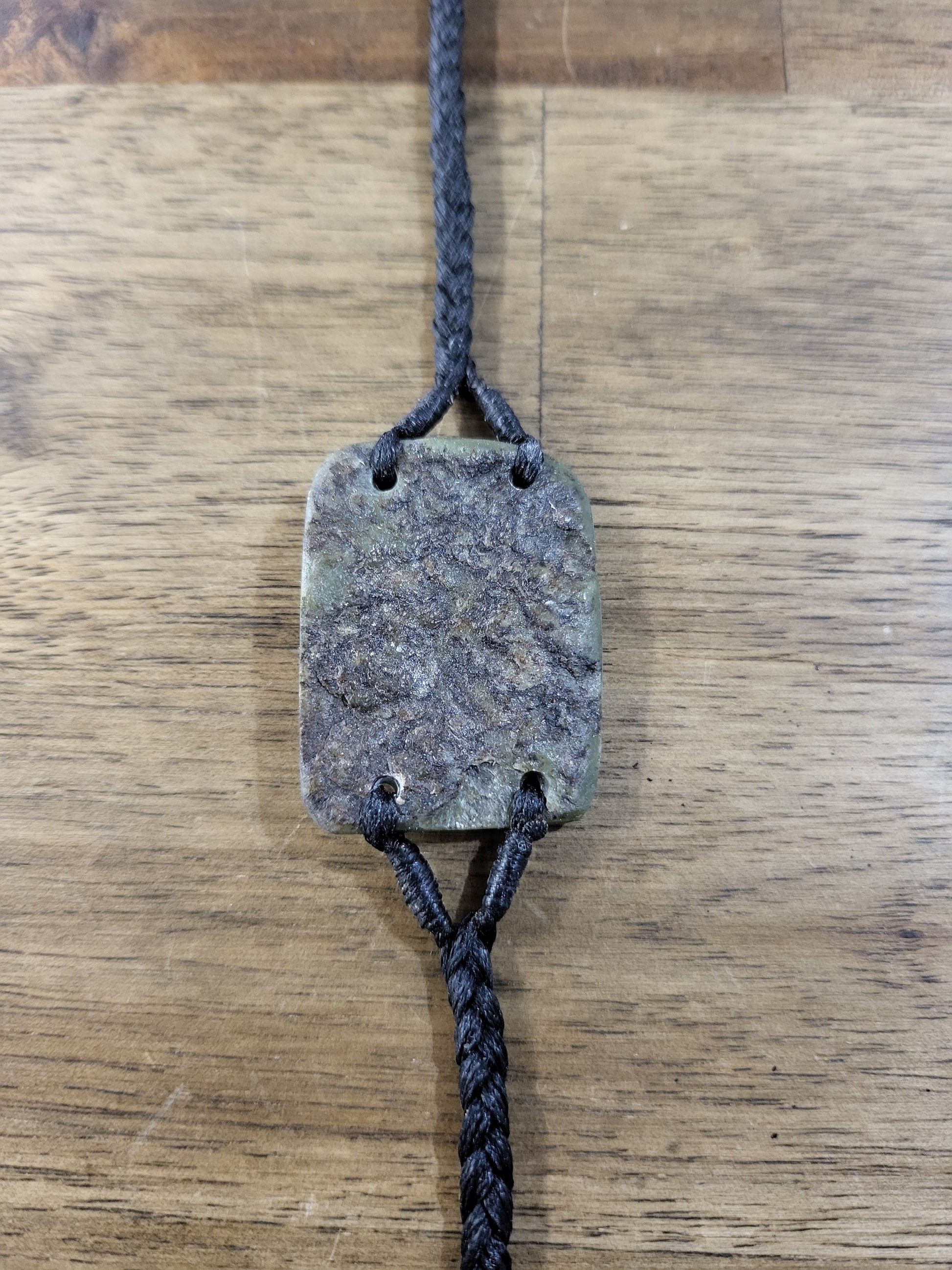 pounamu bracelet (rounded rectangle) on black cord