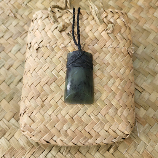 carved pounamu toki (adze) necklace, beautiful colour variations, on black cord