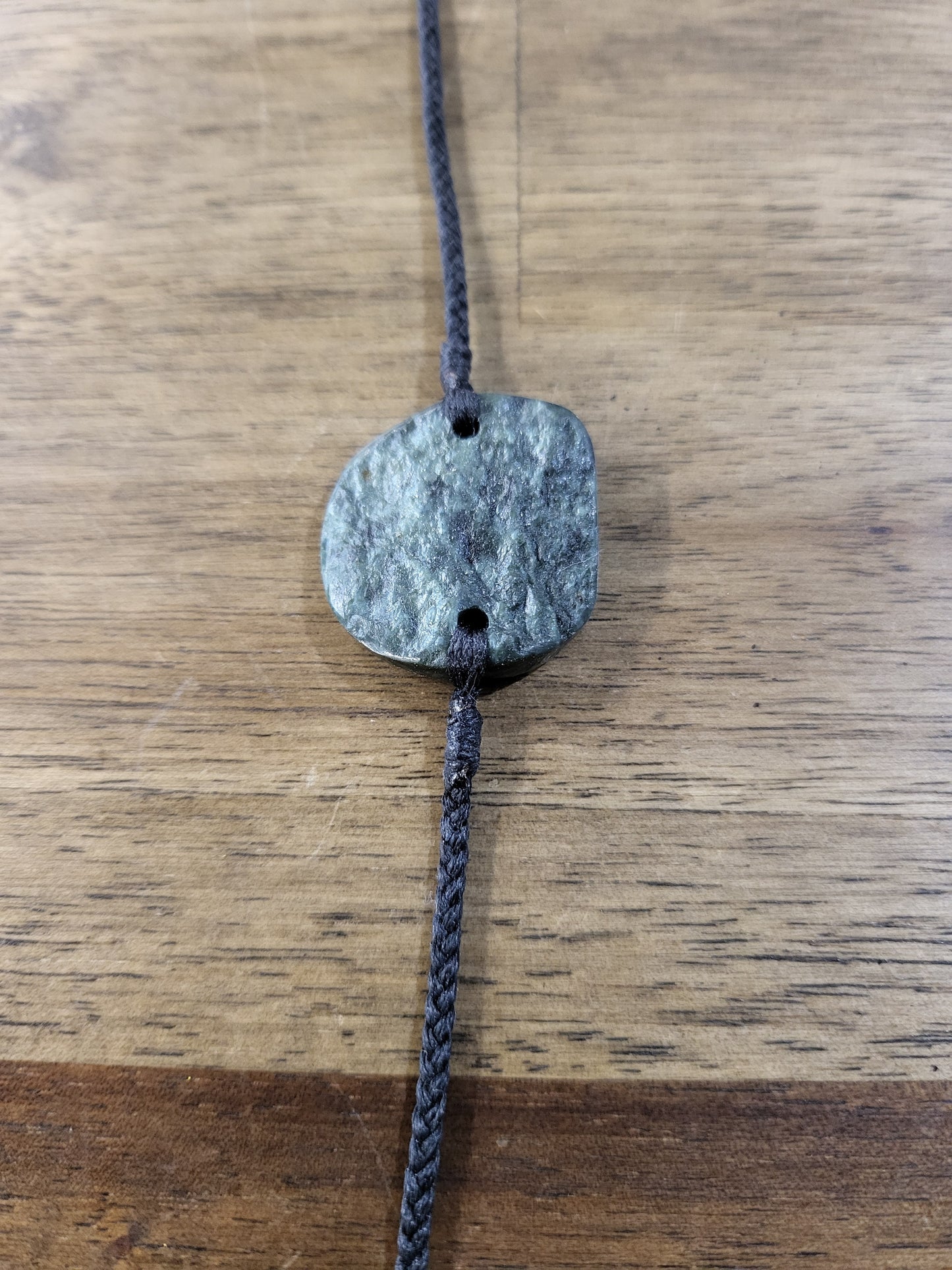 pounamu bracelet (circle) on black cord