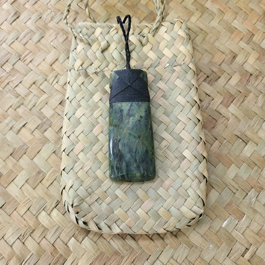 carved pounamu toki (adze) necklace, beautiful colour variations, on black cord