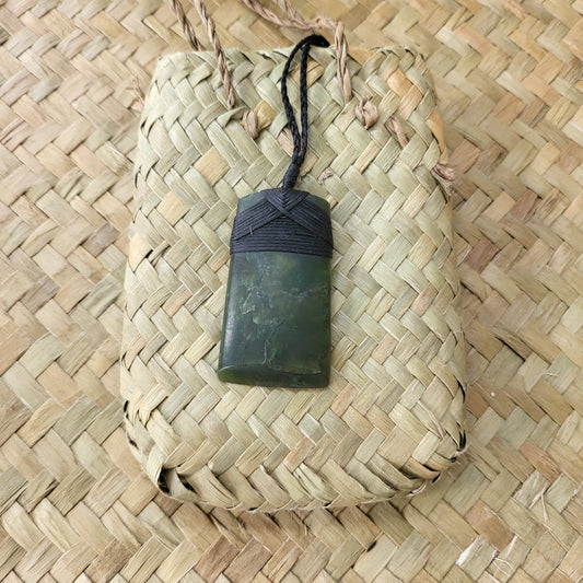 carved pounamu toki (adze) necklace, beautiful colour variations, on black cord