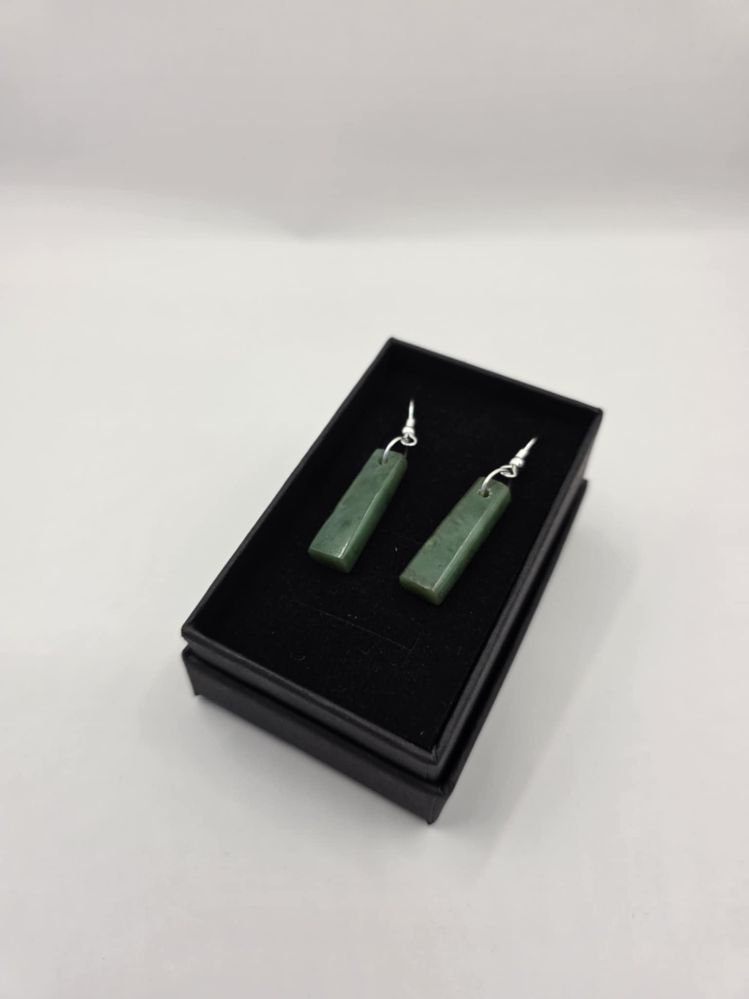 carved pounamu earrings (drop), on silver colour fittings