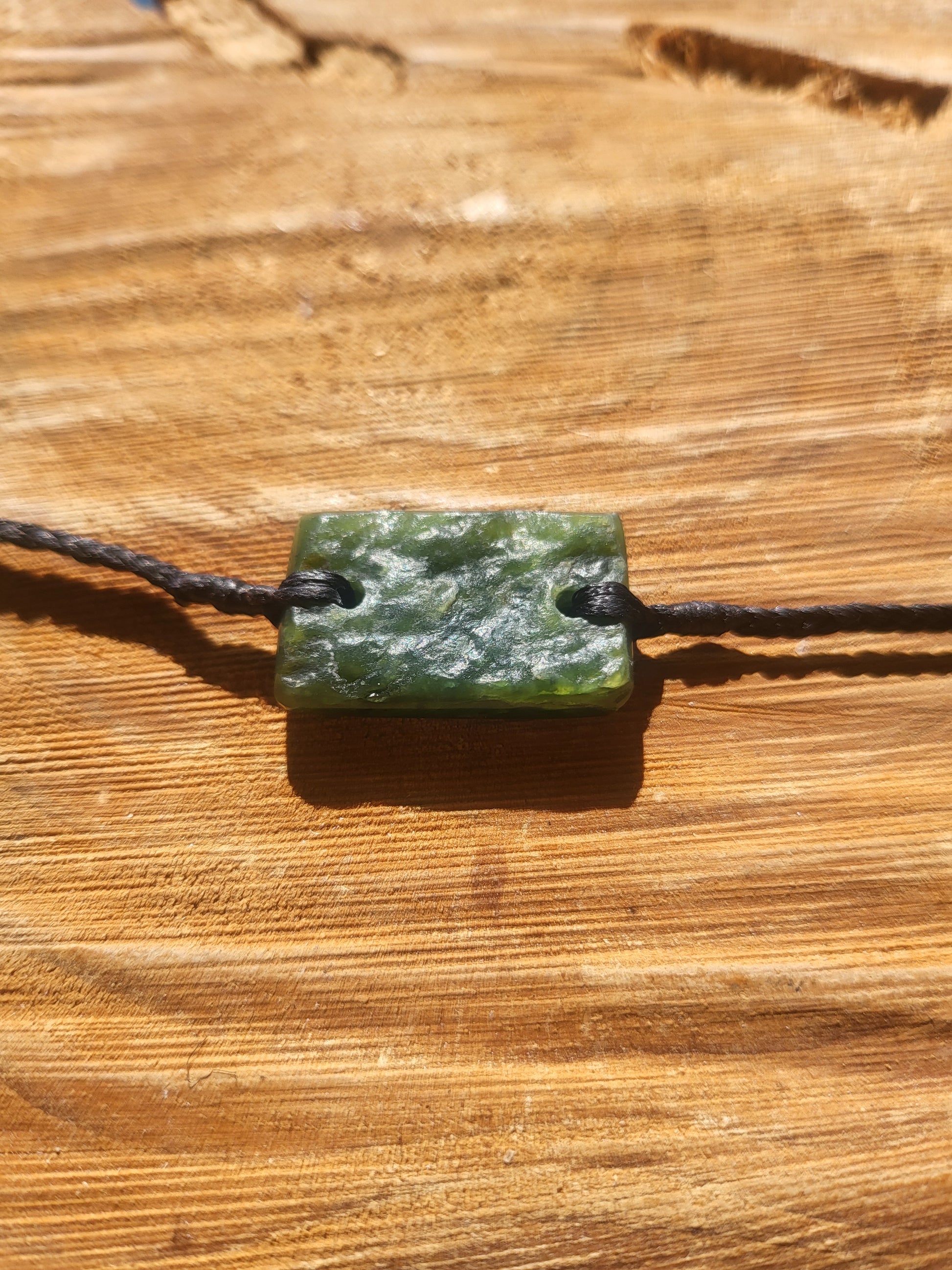 pounamu bracelet (rectangle) on black cord
