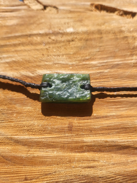 pounamu bracelet (rectangle) on black cord
