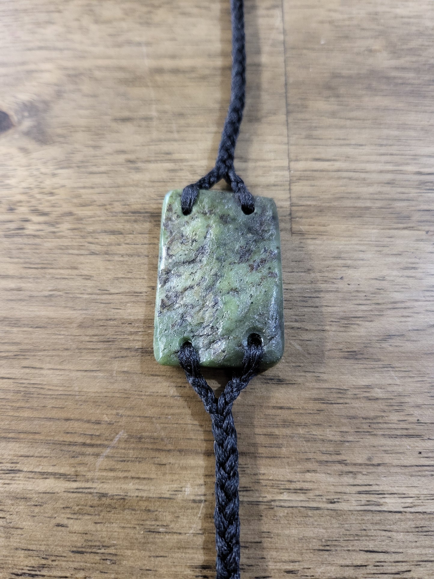 pounamu bracelet (rectangle) on black cord